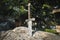 Excalibur, King Arthur\\\'s sword in stone. Edged weapons from the legend Pro king Arthur