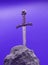 Excalibur, the mythical sword in the stone of King Arthur on purple background