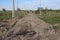 Excavated land for the road lay the direction in the village under construction difficult passage through mud for SUVs