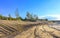 Excavated sand mountains and rubble piles quarry lake dredging pond