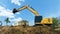 excavating soil into a dump truck to build a pond for store water for use in the dry season for agriculture