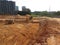 Excavation and ground leveling work using excavator machine and other heavy construction machinery