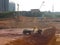 Excavation and ground leveling work using excavator machine and other heavy construction machinery