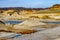 Excavation site, mounds, a pond with blue water in the old marl quarry mine