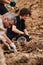 Excavations at the site of a war crime. Site of a mass shooting of people. Human remains bones of skeleton, skulls