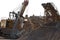 Excavator bucket gaining rubble