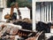 Excavator in a building under demolition, among rubble and dust, for an urban redevelopment .