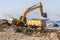 a excavator bulldozer digging dirt ground, shoveling ion the construction site