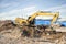 a excavator bulldozer digging dirt ground, shoveling ion the construction site