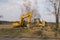 Excavator and bulldozer in the parking lot before work starts