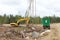 Excavator and cabins for forestry workers on a forest felling plot