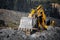 Excavator cleans large soil stones after rock explosion blasting. Open mine coal