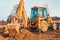 The excavator clears the ground to pave the road in private territory