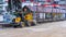 Excavator conducts construction work on a city street