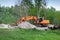 Excavator constructing pipeline