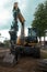 Excavator, construction equipment in urban construction, vertical orientation. Northeim, GERMANY - June, 2020