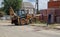 Excavator at a construction site. Heavy machinery at work. A large yellow construction vehicle at a construction site. Industrial