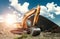 Excavator at the construction site, sand, crushed stone, against the blue sky background. Construction equipment, construction