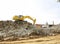 Excavator in the deconstruction works of the ring road of the Plaza de Les Glories Catalanes in Barcelona