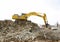 Excavator in the deconstruction works of the ring road of the Plaza de Les Glories Catalanes in Barcelona