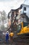 Excavator demolishes the old soviet apartment house in Moscow