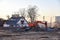 Excavator demolishes an old wooden house in the village for new construction project. Tearing Down a Houses. Building removal made