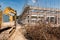 Excavator demolishing old building