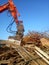 Excavator and destroyed building, earthquake, pile of rubble and debris, landfill