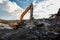 Excavator destroyer removes debris Building demolition