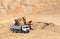 Excavator developing the sand on the opencast and loading it to the heavy dump truck.