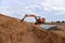 Excavator dig the trenches at a construction site. Trench for laying external sewer pipes. Sewage drainage system for a multi-