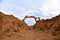 Excavator dig the trenches at a construction site. Trench for laying external sewer pipes. Sewage drainage system for a multi-