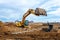 Excavator dig the trenches at a construction site. Trench for laying external sewer pipes. Sewage drainage system for a multi-