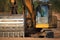 Excavator digger with a huge bucket at a construction site