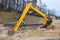 Excavator digs foundation ditch