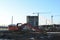 Excavator digs ground at a construction site for installing concrete storm pipes. Backhoe the digging pipeline ditch. Commercial