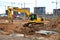 Excavator digs the ground for the foundation and construction of a new building.