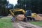 Excavator digs ground for the installation of industrial gas and oil pipes. Natural gas pipeline construction work.