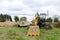 Excavator digs ground for the installation of industrial gas and oil pipes. Natural gas pipeline construction work. A dug trench