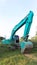 The excavator digs a soil. Digger loading trucks with soil. Excavator working on earthmoving at open pit mining. Excavator working