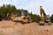 Excavator and Dozer and Vibro Roller Soil Compactor at road construction and bridge projects in forest area. Heavy machinery for