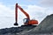 Excavator dredging on beach at St Augustine