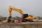 Excavator in the Eendragtspolder to build a new luxury residential area in Zevenhuizen, Netherlands