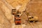 excavator extracts and loads sand into large truck in sand quarry