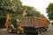 Excavator fills dump truck. Excavator closeup loads stones into body. Road works or construction of something