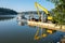 Excavator on floating platform on a sunny morning