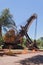 Excavator in front of the entrance of the former iron mines in Thabazimbi, South Africa