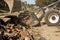 Excavator, grader and workers remove debris after dismantling a tram stop