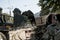 Excavator, grader and workers remove debris after dismantling a tram stop