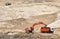 Excavator load the sand to the heavy dump truck in the open-pit. Heavy machinery working in the mining quarry. Digging and